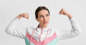Woman with her arms in victory because her immune health is strong.