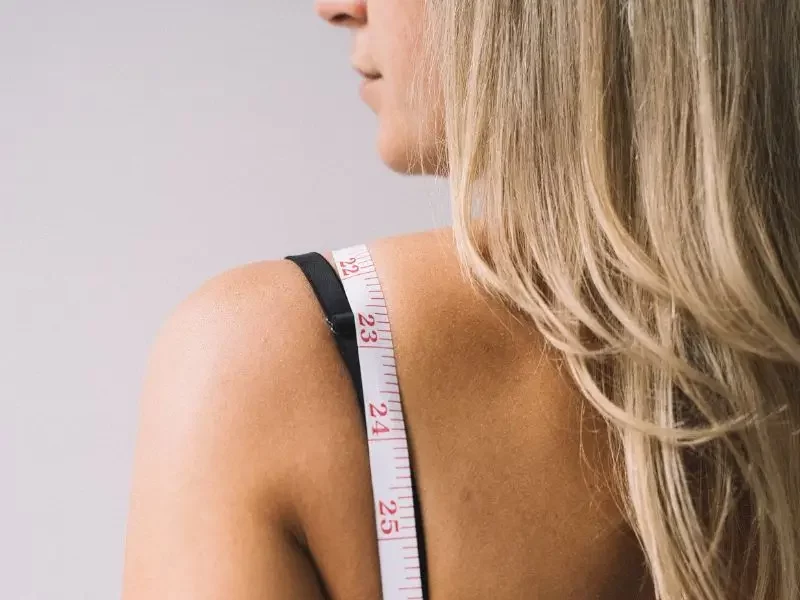 Metabolic-Issues600x800 Woman with metabolic issues with a tape measure draped over her shoulder.